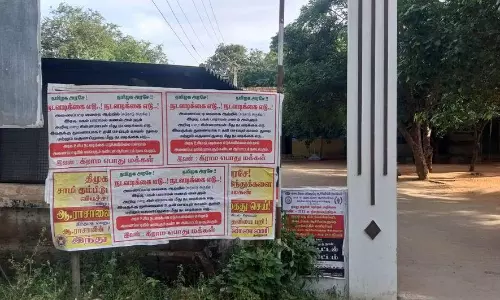 கிராம மக்கள் ஒட்டிய போஸ்டரால் பரபரப்பு