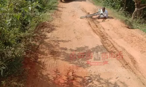 குண்டும், குழியுமான சாலையை சீரமைக்க வேண்டும்