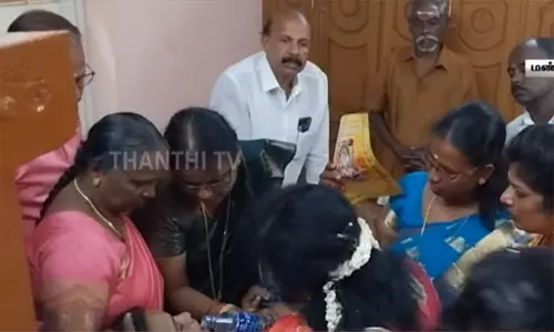 கோவிலில் திடீரென மயங்கி விழுந்த பெண்... கவர்னரே முன்வந்து முதலுதவி - நெகிழ்ச்சி செயல்