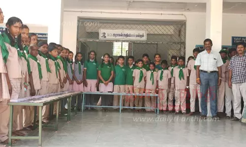 அரசு பள்ளியில் நெல் விதை கண்காட்சி