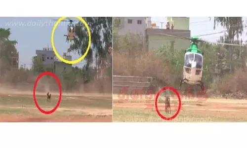 எடியூரப்பா ஹெலிகாப்டர் தரை இறங்கியபோது குறுக்கிட்ட தெருநாய்கள்