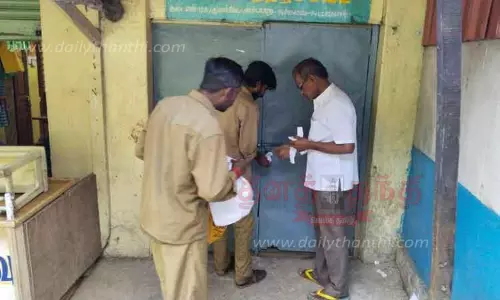 வரி பாக்கி செலுத்தாத 12 கடைகளுக்கு சீல்