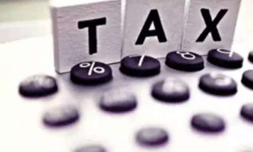 நாமக்கல்லில் வரி பாக்கி வைத்துள்ள நபர்களின் பெயர்கள் அடங்கிய பேனர்-நகராட்சி நிர்வாகம் சார்பில் வைக்கப்பட்டது