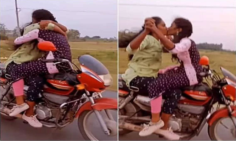 ஓடும் பைக்கில் முத்த சண்டை சாகசம் செய்த  இளம்பெண்கள் வைரலாகும் வீடியோ...!