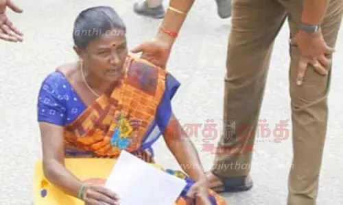 தர்ணாவில் ஈடுபட்ட பெண்ணால் பரபரப்பு தர்ணாவில் ஈடுபட்ட பெண்ணால் பரபரப்பு