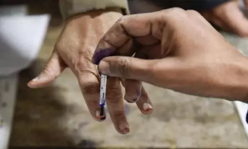 கர்நாடக சட்டசபை தேர்தல்: முதல் முறையாக முகத்தை அடையாளம் கண்டு வாக்களிக்கும் புதிய வசதி அறிமுகம்