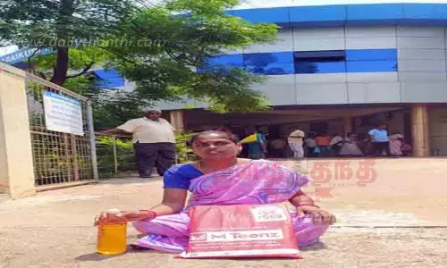 பெட்ரோல் கேனுடன் போராட்டம் நடத்திய பெண்ணால் பரபரப்பு