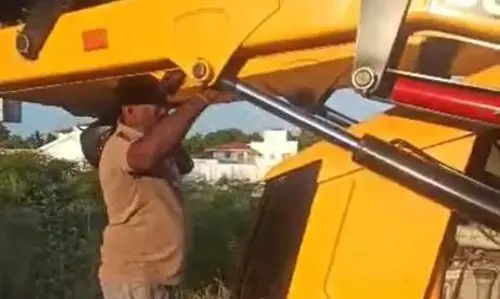 பா.ஜனதா பிரமுகரை பொக்லைனை ஏற்றிக்கொல்ல முயன்றதாக புகார்