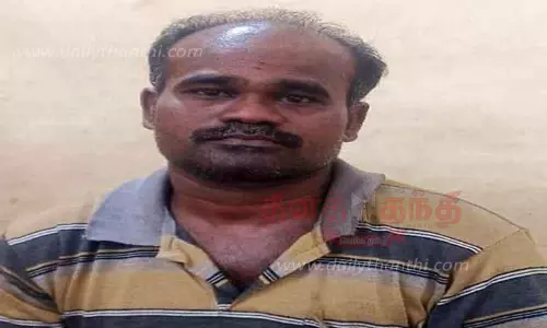 மூதாட்டியிடம் ஏ.டி.எம். கார்டை மாற்றிக் கொடுத்து பணம் மோசடி; காவலாளி கைது