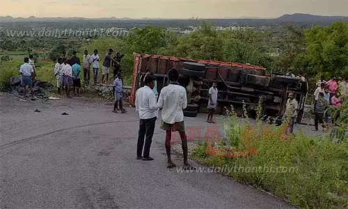 பசவன மலையில் லாரி கவிழ்ந்தது; பெண் பலி