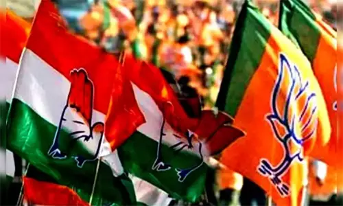 நாடாளுமன்ற ஊழியர்களின் புதிய சீருடையில் தாமரை படம்: காங்கிரஸ் எதிர்ப்பு