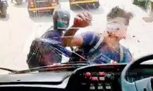 அரசு பஸ் கண்ணாடியை உடைத்தவர் கைது