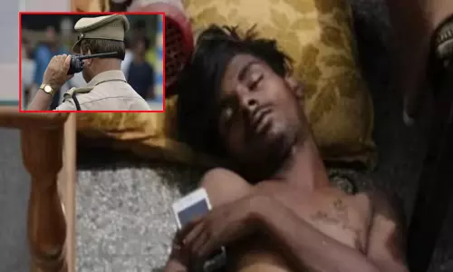 திருட சென்ற வீட்டில் ஏ.சி. போட்டு தூங்கிய திருடன்... தட்டி எழுப்பிய போலீசார்