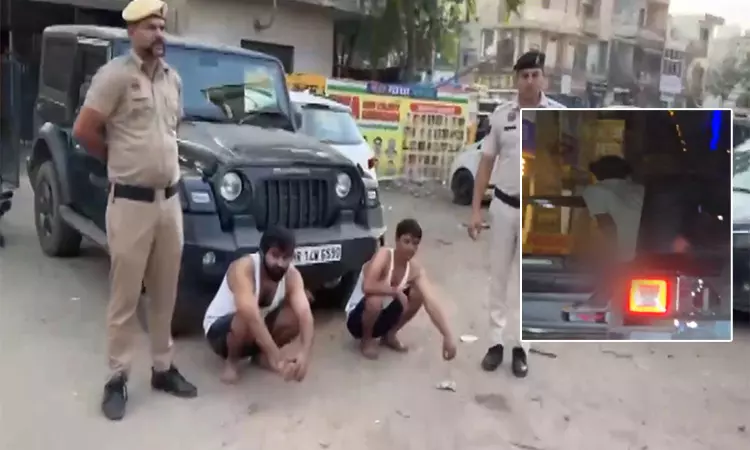 அரியானாவில் ஓடும் காரில் கதவை திறந்து சிறுநீர் கழித்த விவகாரம் - இருவர் கைது
