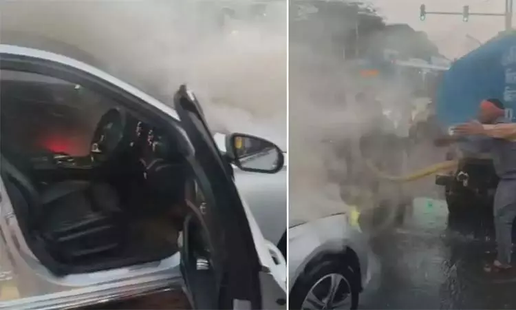 நடுரோட்டில் தீப்பற்றி எரிந்த சொகுசு கார் - 5 வயது மகனுடன் உயிர் தப்பிய பெண்