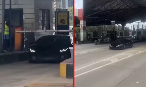 சுங்க சாவடியில் கேட் போட்டும்... கட்டணம் செலுத்தாமல் பறந்த சொகுசு கார்; வைரலான வீடியோ