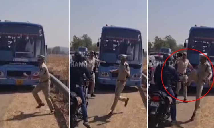 கர்நாடக முதல்-மந்திரி வருகை; போக்குவரத்தை சரிசெய்ய பைக் ஓட்டுநரை எட்டி உதைத்த போலீஸ் அதிகாரி